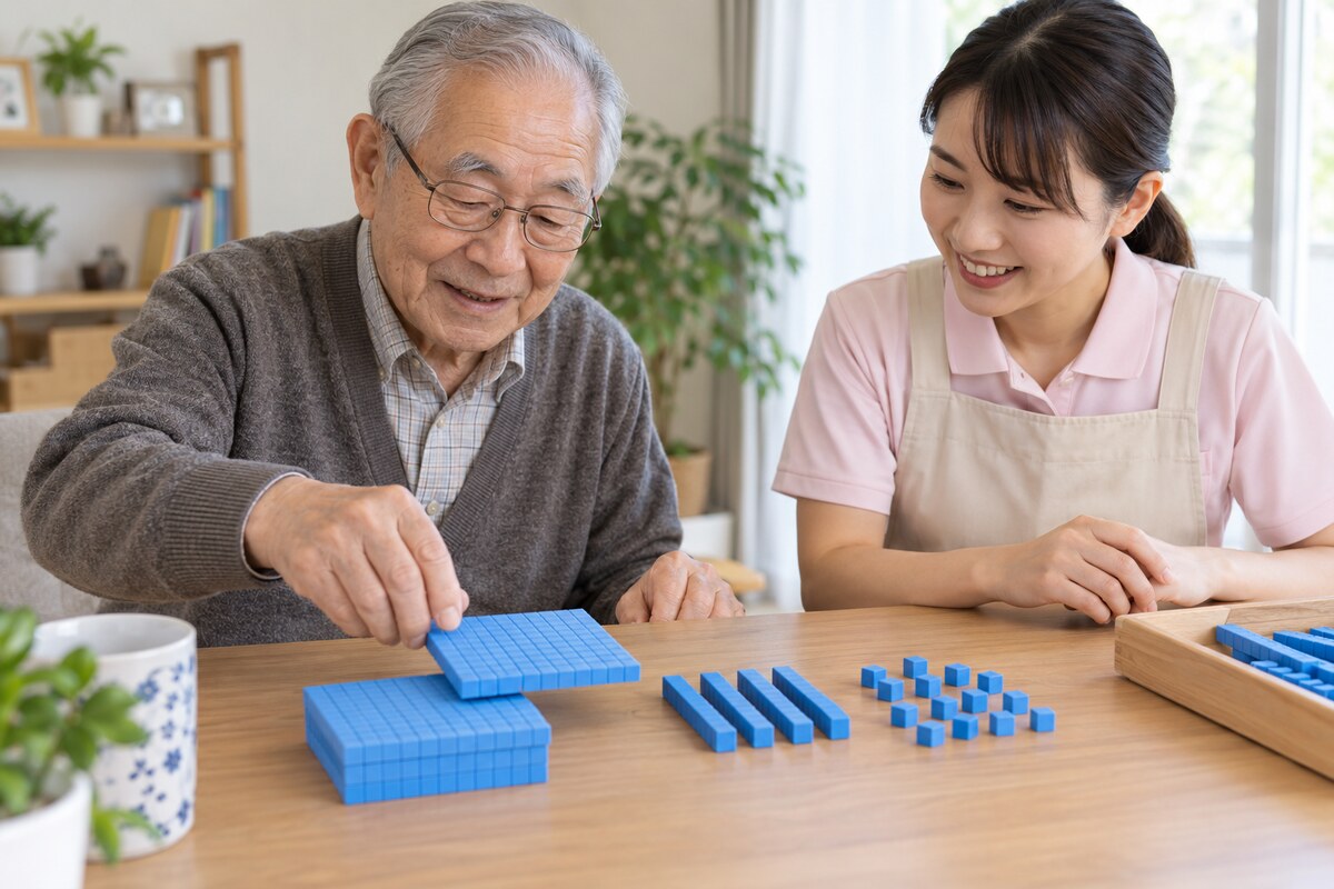 位取りブロックを使って3桁の足し算を考える高齢者