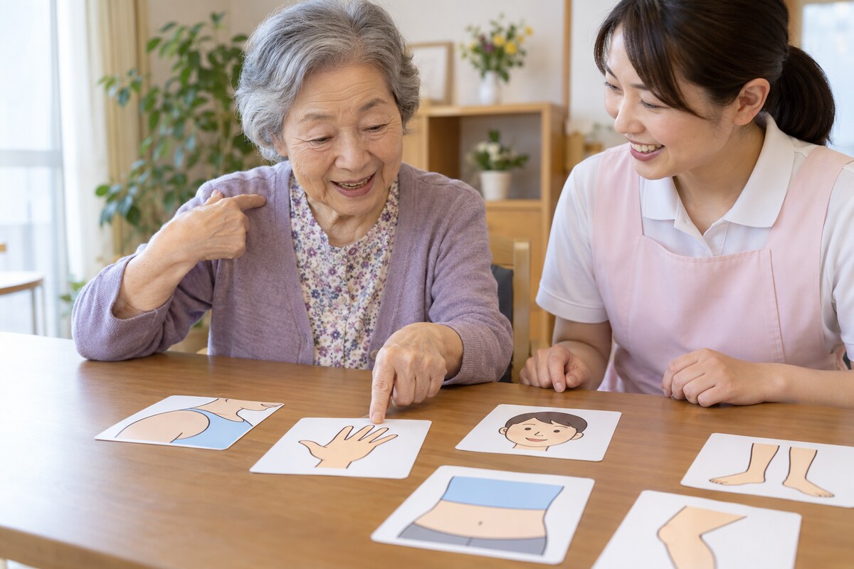 身体の部位を表す絵カードに取り組む高齢者