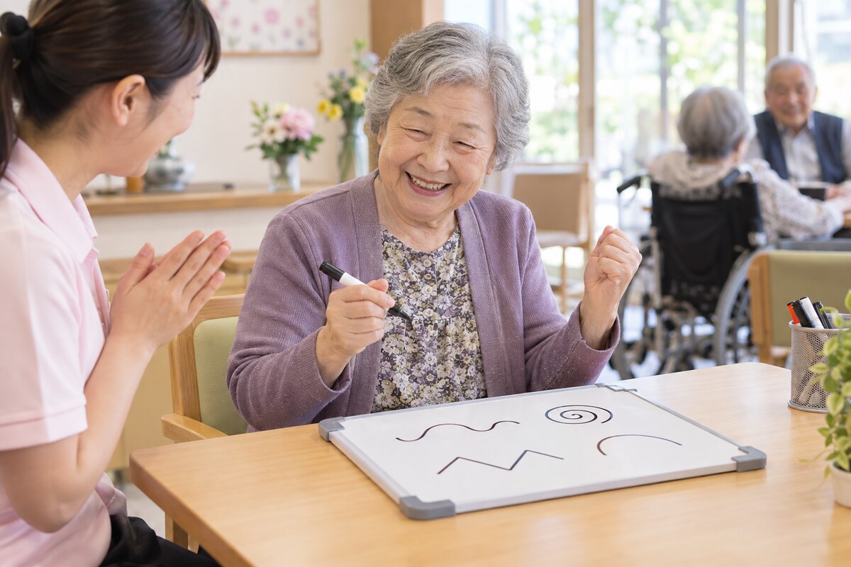 ホワイトボードに線を書いて達成感を味わう高齢者